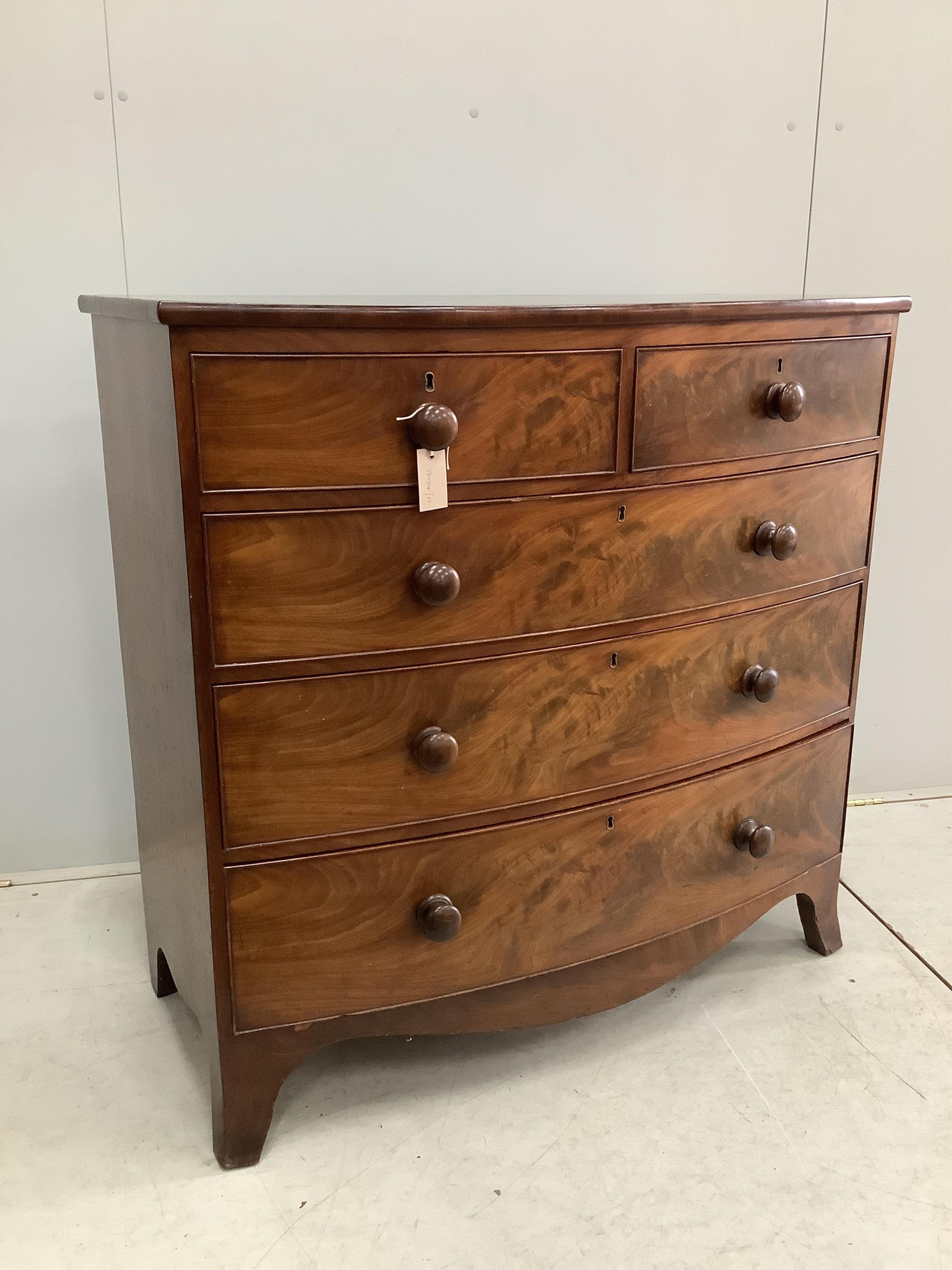 A Regency mahogany bow front chest of drawers, width 105cm, depth 52cm, height 104cm. Condition - fair